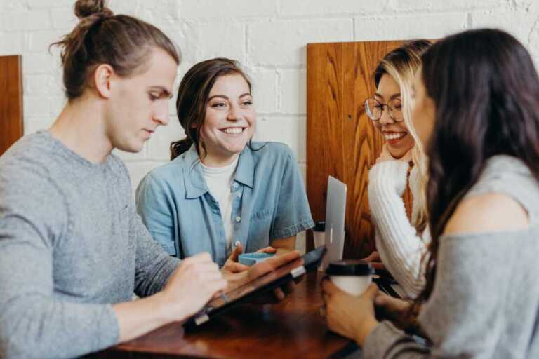 Young People in a meeting smiling